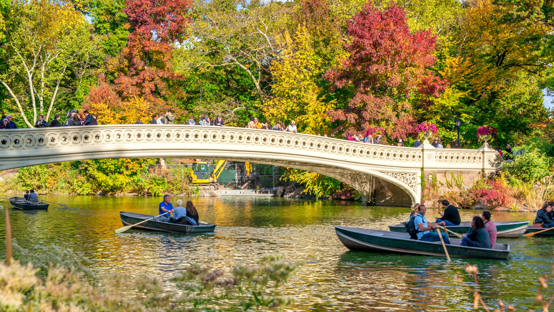 NEW YORK CITY, USA - OCTOBER 25TH, 2015: Tourists rent a boat on the lake in Central Park. It is a main city attraction