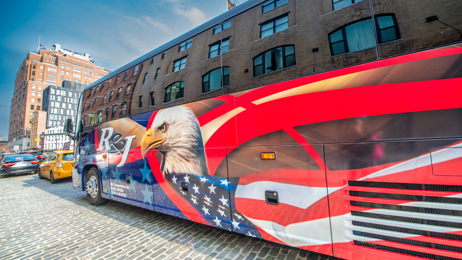 NEW YORK CITY, USA - DECEMBER 1ST, 2018: Beautiful american bus with eagle and red, blue and white colors in New York City