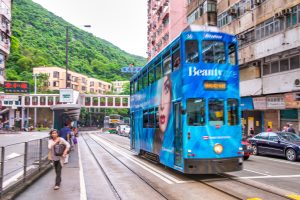 HONG KONG - MAY 11. 2014: Narrow street bus along Hong Kong roads